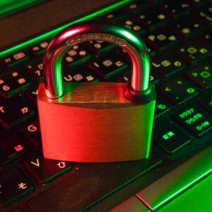 A lock placed on a keyboard depicting a secure web environment using the concepts of penetration testing.